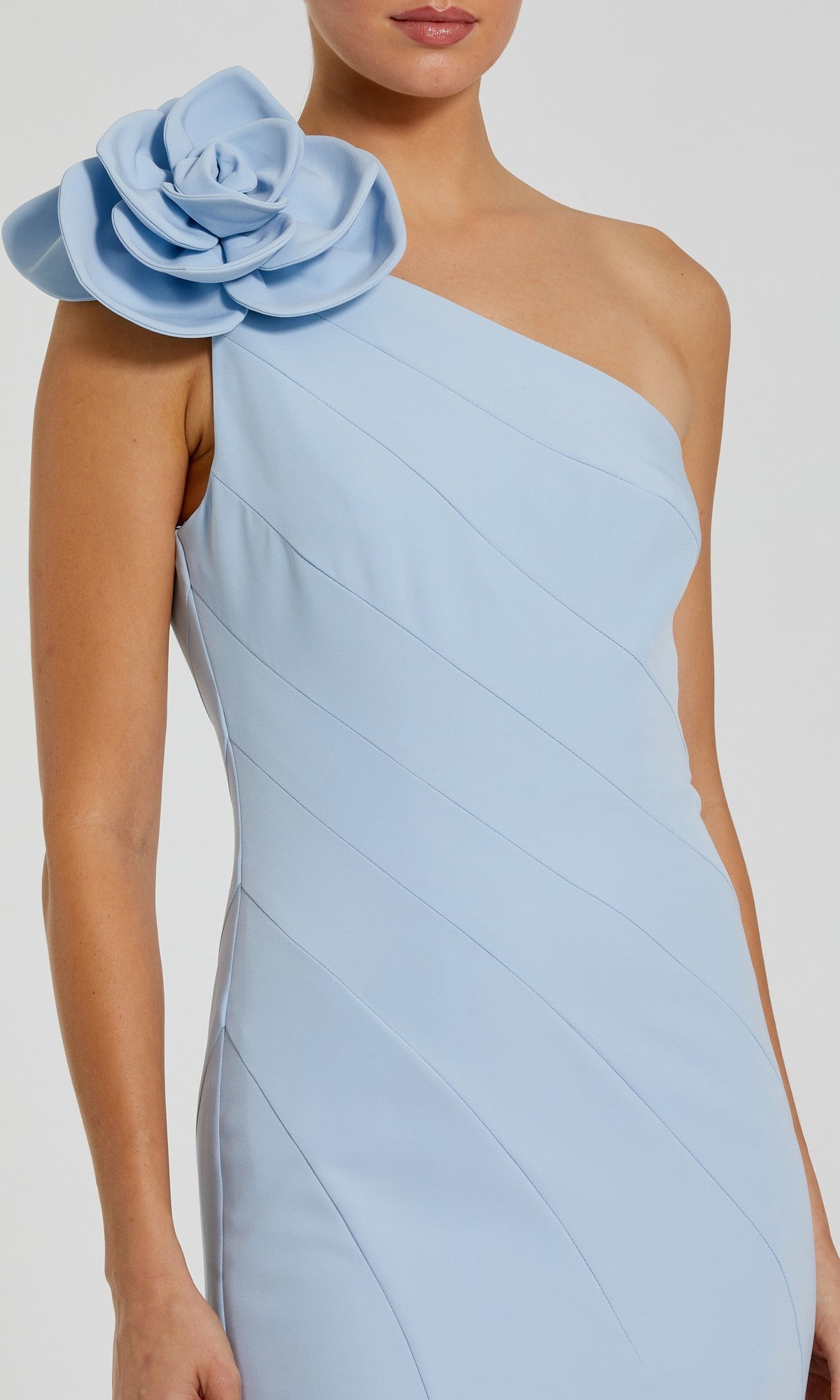 Woman in the Flower One-Shoulder Formal Dress: Mac Duggal 2304, a light blue mermaid gown with a large fabric flower accent on one shoulder.